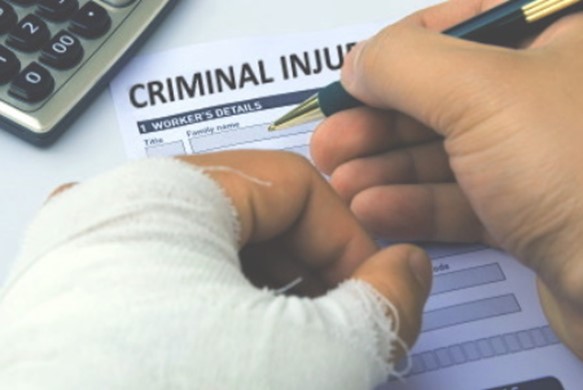 injured man completing a Criminal Injury Claim