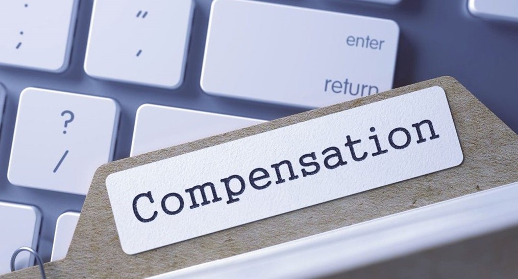 File folder with the words "Compensation" written on